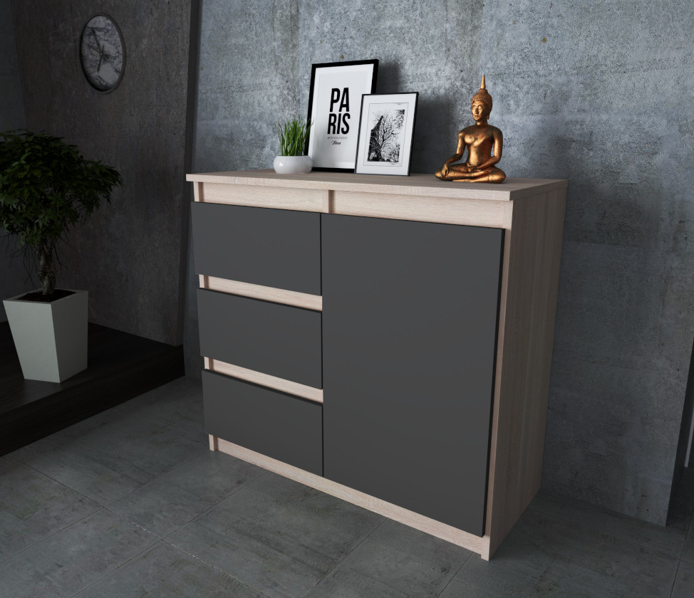 Komoda Agnes 80cm z 1 drzwiami i 3 szufladami na tle rzeczywistym z korpusem w kolorze dab sonoma i frontami w kolorze szary mat