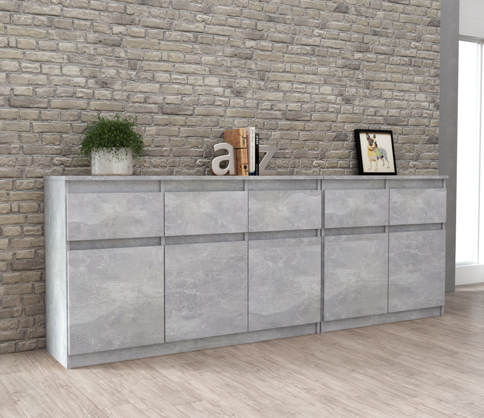 Komoda Best Oleksa 200cm z 6 drzwiami i 6 szufladami na tle rzeczywistym z korpusem w kolorze beton i frontami w kolorze beton